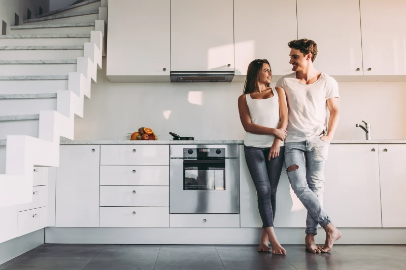 Couple standing in kitchen